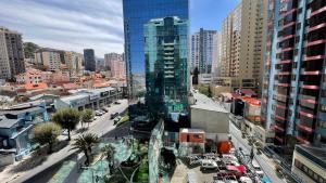 a city with tall buildings and a street with cars at Muy cerca, a pasos de la Embajada de EEUU in La Paz