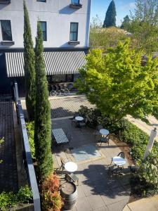 an overhead view of a patio with chairs and trees at 3rd Street Flats in McMinnville