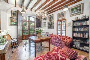 a living room with a couch and a table at Hostal Miramar in Deia