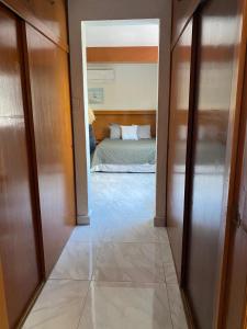 a view of a bedroom from a hallway with a bed at Galeria Elementos, Tierra in Campeche
