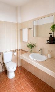 a bathroom with a toilet and a sink at Holiday House Kata & Karon Phuket Hotel in Kata Beach +16 photos
