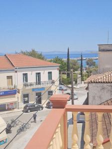 a balcony of a building with a view of a street at Amfitrion on the Town in Gythio