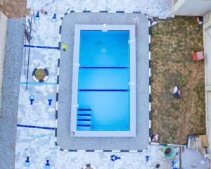 an overhead view of a large swimming pool at Cozycore Apartment in Dodoma