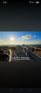 a picture of a staircase with the sun in the sky at Apartament ZłotogórSKI Lądek-Zdrój in Lądek-Zdrój