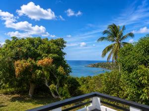 a view of the ocean from a balcony at Paradise Inn in Laborie