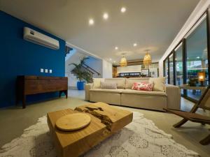 a living room with a couch and a table at Casa Baião in Fortim