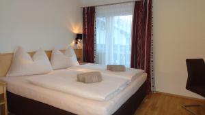 Postel nebo postele na pokoji v ubytování Appartements Gassner