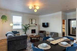 a living room with a table and chairs at 3rd Street Flats in McMinnville