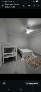 a rendering of a bedroom with a bed and a table at Recanto Rafaela 2 in Olímpia