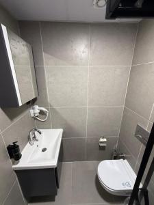 a bathroom with a sink and a toilet at Twelve Diamond Hotel in Istanbul