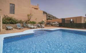 a swimming pool in front of a house at Mirador de las Gaviotas in Mojácar