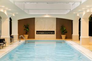 a swimming pool in a room with a fireplace at Fairmont Royal York Hotel in Toronto