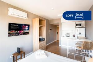 a small apartment with a kitchen and a living room at Live Belgrano Boutique Apartments in Buenos Aires