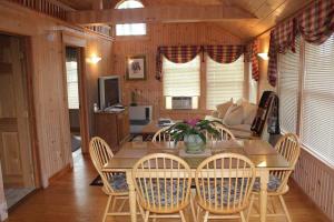 a dining room with a table and chairs at Sebago Waterfront Escape with Private Dock in Windham