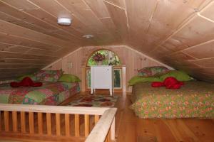 a room with two beds in a house at Sebago Waterfront Escape with Private Dock in Windham