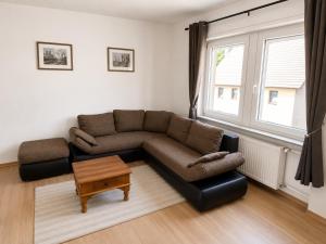 a living room with a couch and a table at Ferienwohnung Ernzerhof in Idar-Oberstein