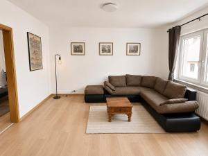 a living room with a couch and a coffee table at Ferienwohnung Ernzerhof in Idar-Oberstein