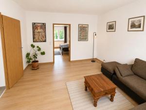 a living room with a couch and a coffee table at Ferienwohnung Ernzerhof in Idar-Oberstein