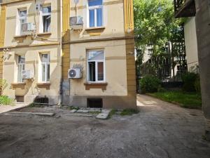 an apartment building with a window on the side of it at Alice house in Sofia