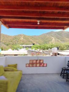 a living room with a view of the mountains at Casalajud Wellness in Taganga