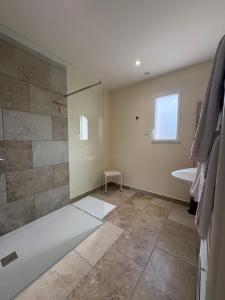 a bathroom with a shower and a sink at La Parenthèse in Le Plouy +17 photos