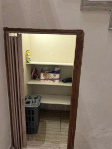an open door to a kitchen with a stove at Be my guest in Roodepoort