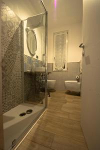 a bathroom with a shower and a toilet and a sink at LE GEMME Bed & Breakfast con parcheggio e giardino in Casarza Ligure +32 photos