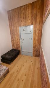 a small room with a closet and a bed in it at Helme mõis in Helme