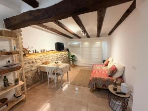 a living room with a couch and a table at Casa Inés in Xerta