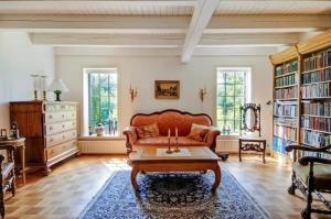 a living room with a couch and a coffee table at Skovgaardsvej 7 in Udby