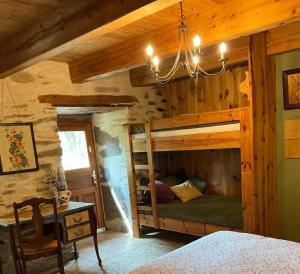 a bedroom with a bunk bed in a log cabin at The Village in Anzat-le-Luguet