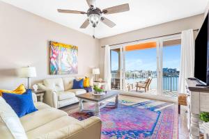 a living room with a couch and a table at Harborview Oasis in Clearwater Beach in Clearwater Beach +30 photos