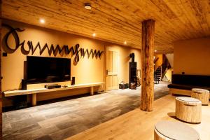 A television and/or entertainment centre at alpen select lodge Kleinwalsertal