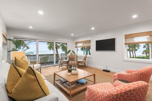 a living room with a couch and a table at Beachfront Aldea 12 in Clearwater Beach