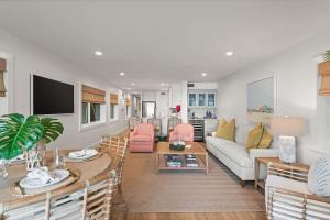 a living room with a couch and a table at Beachfront Aldea 12 in Clearwater Beach +32 photos