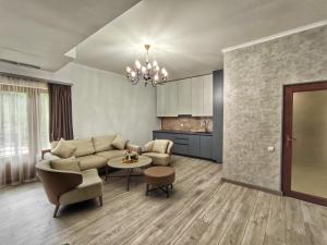 a living room with a couch and a table at Hotel Ijevan in Ijevan