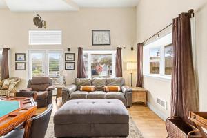 a living room with a couch and a table at Harbor SeaShell in Lincoln City