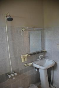 a bathroom with a sink and a mirror at Hotel Hills City, Swat in Mingāora +55 photos