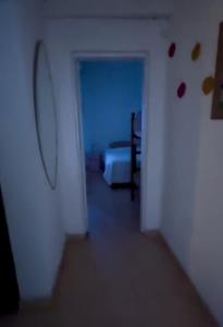 a room with a bed and a room with a room at Casa tranquila Paso de la Patria in Paso de la Patria