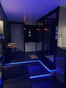 a room with a room with blue lights on the floor at Work In Spa in Voiron