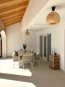 a patio with a table and chairs and a table at Villa Noma in Lovište