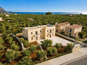 an aerial view of a house in a field at Villa Castillo Thio in Agios Nikolaos