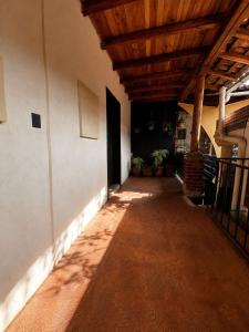 an empty hallway of a building with a wooden ceiling at Hotel Mary o in Valle de Bravo