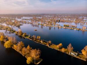 an aerial view of a large river with a city at La détente in Féchain