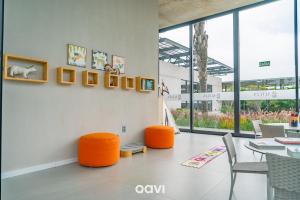 a dining room with orange chairs and a table at Casa de Alto Padrão na Serra de Bananeiras by Qavi in Bananeiras +143 photos