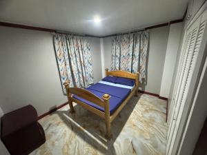 Llit o llits en una habitació de Max Cozy Corner