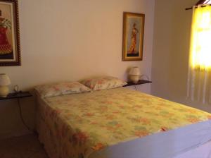 Ένα ή περισσότερα κρεβάτια σε δωμάτιο στο Rey das Ostras Pousada