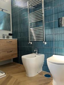 a bathroom with a toilet and a sink at B&B La Rotonda in Frattamaggiore +24 photos