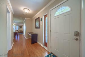 an empty hallway with a white door and a table at CL 2459 Yellow Rose in Canyon Lake