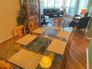 a living room with a table and chairs at IC 216 Inverness Condos Comal River in New Braunfels +22 photos